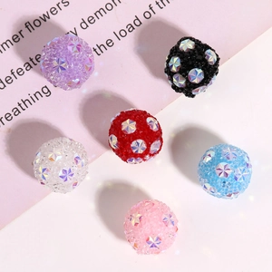 Macro shot of colorful Shamballa beads with snowflake crystals and sparkling pave rhinestones