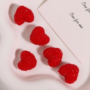 Close-up of five red sugar-coated resin heart charms for DIY crafts and jewelry making