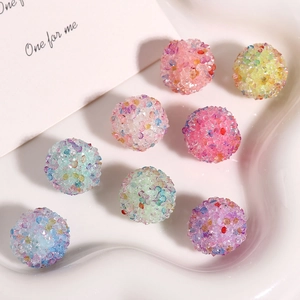 Macro shot of colorful rhinestone-encrusted round beads for DIY jewelry making