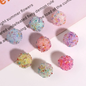 Close-up of colorful sparkling resin sugar ball beads for DIY jewelry and hair accessories