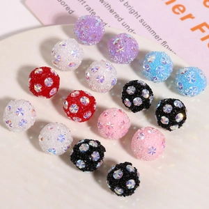 Colorful frosted star beads set on white plate for DIY handmade jewelry and earrings