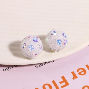Close-up of snowflake pattern beads for DIY earrings with sugar texture finish
