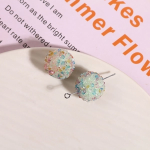 Macro shot of shimmering colorful crystal sugar beads and resin jewelry components
