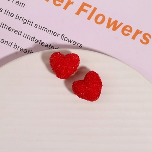 Macro shot of 3D red heart resin beads with sugar-like texture for DIY jewelry making