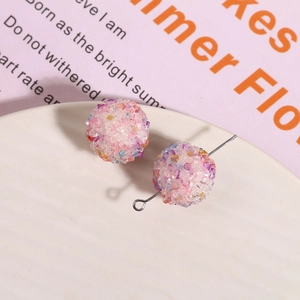 Macro shot of colorful sugar ball resin beads with glitter for DIY jewelry making