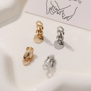 Close-up of gold and silver clip-on earring converters for DIY jewelry making