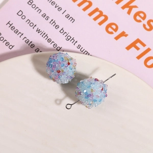 Macro view of pastel sugar crystal beads with metal pins for DIY earring crafts