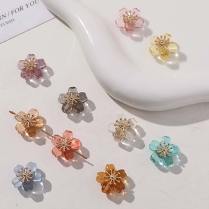 Detailed view of colorful translucent five-petal flower beads for DIY jewelry making