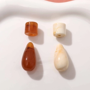 Polished amber and milky white resin waterdrop charms for DIY earring making