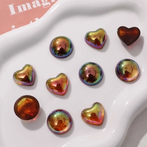 Detailed view of colorful heart-shaped resin charms with metallic rainbow plating