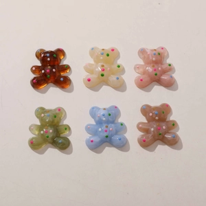 Set of six colorful resin cartoon bear charms with vibrant polka dot patterns for DIY crafts