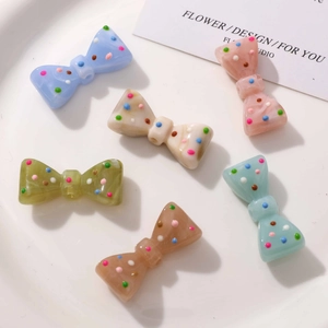 Nœuds en résine colorés avec pois et trous centraux pour création de bijoux DIY lot