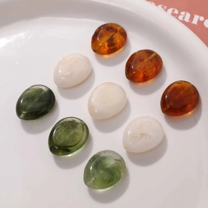 Polished marble effect resin oval beads in amber, cream and dark green colors for DIY