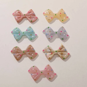 Set of colorful resin bow charms with polka dots and marble texture for DIY accessories