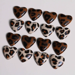 Detailed view of 15 pieces of leopard print heart-shaped PU leather patches for DIY crafts