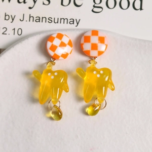 Checkerboard pattern tooth earrings with translucent yellow resin charm drop