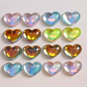 Macro view of 16 gradient translucent resin heart beads with pearlescent AB coating