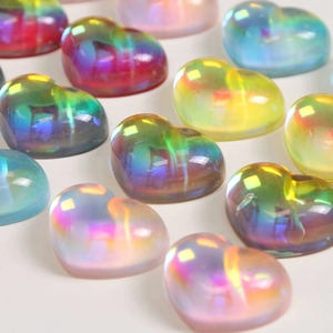 Macro detail of holographic resin heart charms with vibrant iridescent color gradient