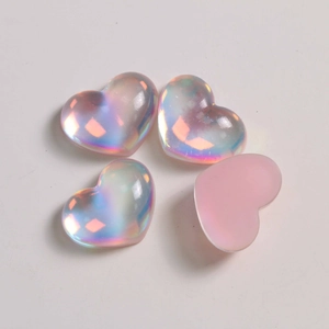 Macro detail of pink aurora heart resin charms with flat back for DIY crafts
