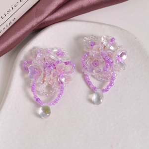 Handmade beaded floral earrings with light purple crystals and iridescent teardrop pendants