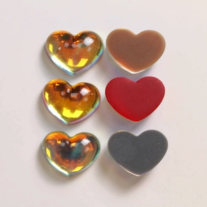 Macro detail of assorted gradient heart resin charms for DIY jewelry and accessories