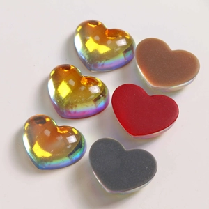 Macro shot of 6 gradient resin heart charms with aurora finish for DIY jewelry crafts