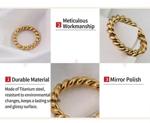 Detail of twisted rope design titanium steel ring with 18k gold plating and mirror finish