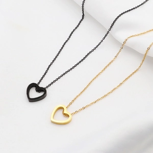 Ins style stainless steel necklace featuring matte black and brushed gold hollow heart pendants