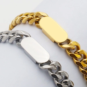 Gold and silver cuban link bracelets with blank oval metal plates for custom engraving