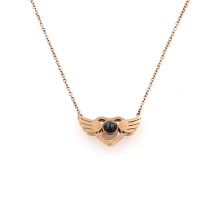 Rose gold angel wing heart pendant necklace with projection stone on white background