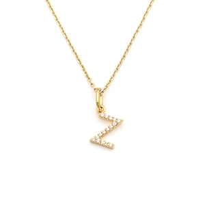 Close-up of golden stainless steel necklace with sparkling Z-letter pendant and zircons