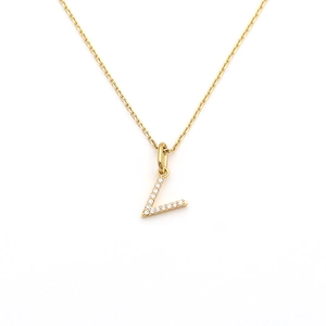 Macro detail of gold letter L pendant with sparkling micro-pave crystals on thin chain