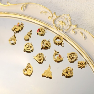 Golden stainless steel pendants set with hollow engraving, enamel and zircon details