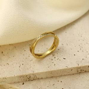 Elegant 18K gold plated titanium steel crossover ring with sparkling pavé cubic zirconia