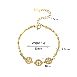 Detail of bamboo texture chain bracelet with star charms and lobster clasp on white background