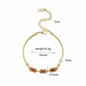 Vintage gold titanium steel bracelet featuring rectangular ruby-red cubic zirconia accents