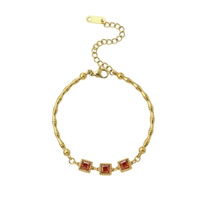 Golden bamboo chain bracelet featuring three square red stones with vintage beaded edges