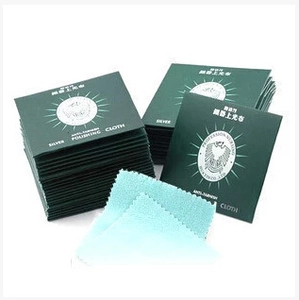 Polishing cloth for silver jewelry in green paper packaging with blue inner fabric