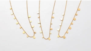 Detailed view of three gold geometric necklaces featuring teardrop, rectangle, and disc charms