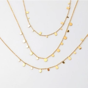 Three minimalist gold necklaces with geometric drop, circle and rectangle pendants