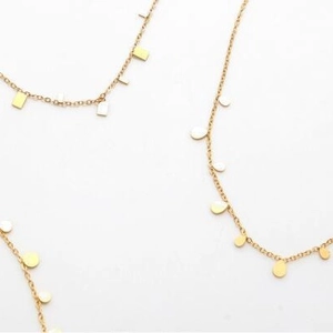 Minimalist gold geometric necklace with square and round charms on a delicate chain