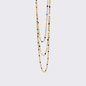 Collar de acero de titanio dorado con cuentas de esmalte en degradado azul y blanco