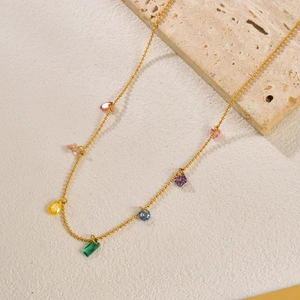 Rainbow gemstone drop necklace with colorful zircons on a gold beaded chain