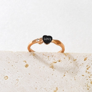 Rose gold wavy ring with black heart LOVE print and small zircon on stone base