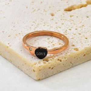 Rose gold stainless steel ring featuring a black heart with LOVE text and a small crystal