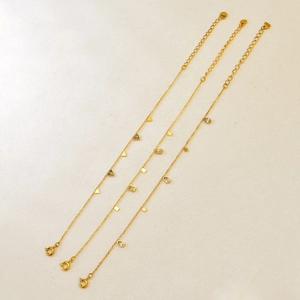 Three 18K gold-plated geometric bracelets featuring teardrop square and triangle zircons