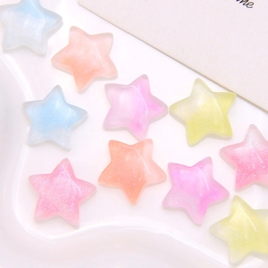 Macro shot of colorful glitter resin star charms for DIY crafts and jewelry making