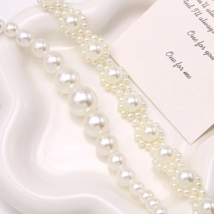 Elegant cream white faux pearl chains for shoes decoration in a stylish gradient and woven design