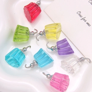 Macro shot of colorful translucent resin jelly charms with silver hooks for jewelry DIY