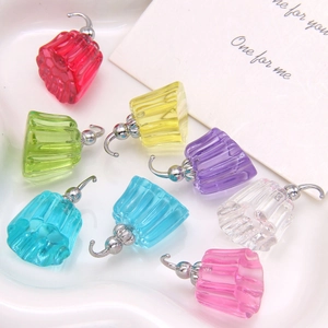 Close-up of colorful translucent jelly pudding resin charms with silver metal hooks